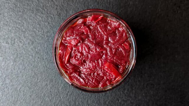 Grated beetroot with salt and spices as an ingredient for borscht or a vegan salad. Grated beetroot as a food background for your design
