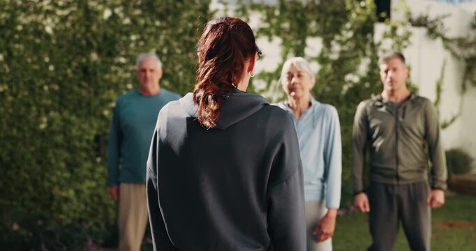 Fitness, instructor and people with outdoor class for senior wellness, health and shoulder shrug. Retirement group, trainer or workout with neck exercise for pilates, practice or training in backyard