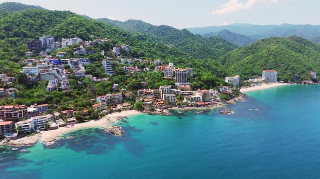 Beautiful aerial view of conchas chinas beach and the turquoise ocean in puerto vallarta mexico