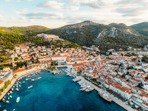 Aerial view of the historic Hvar town and the Spanish Fortress (Fortica) overlooking the harbor and Adriatic sea, Hvar island, Dalmatia, Croatia.