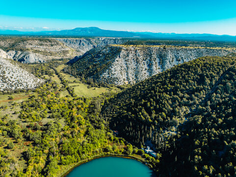 Aerial view of the confluence where the Cikola river lake drom torak view tributary joins the Krka river canyon, Krka National Park, Dalmatia, Croatia.