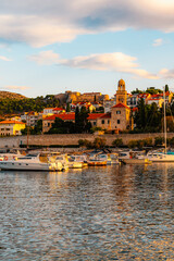 Naklejka premium Hvar town and Pakleni Islands viewed from the medieval Spanish Fortress, golden hour over the Adriatic sea, Croatia.