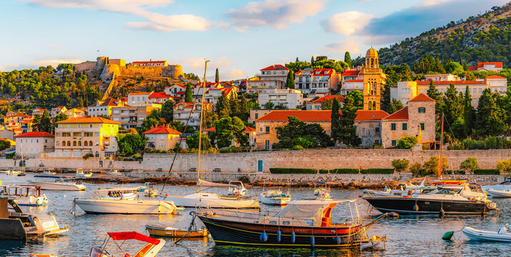Hvar town and Pakleni Islands viewed from the medieval Spanish Fortress, golden hour over the Adriatic sea, Croatia.