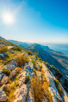 Panoramic view from Skywalk Biokovo glass platform overlooking Makarska Riviera, Adriatic sea and islands, Biokovo Nature Park, Croatia.