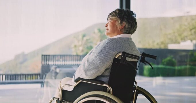 Thinking, wheelchair and old woman in home with window, contemplating and nostalgia. Retirement, reflection and senior person with disability in house with view, calm mindset and space to relax