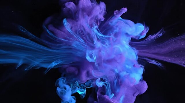 Abstract blue and purple paint swirls colliding and diffusing in water on black background