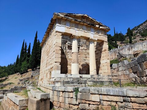 Photo of the Athenian Treasury at Delphi, Greece, built by the Athenians to safeguard dedications and votive offerings presented to the sanctuary of Apollo. 