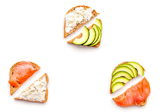 Mini sandwich set with french baguette, cheese, fish and avocado on white background top view mock up