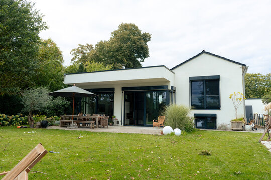 Modern house with garden under sky