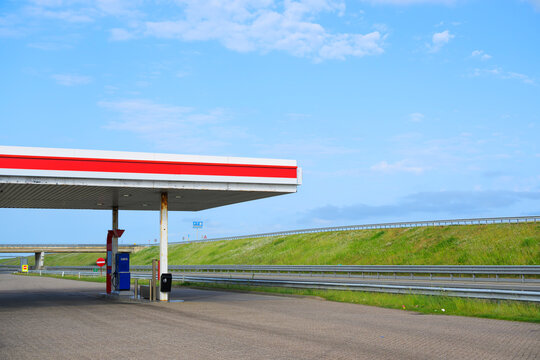 An empty petrol station stands near the Afsluitdijk motorway