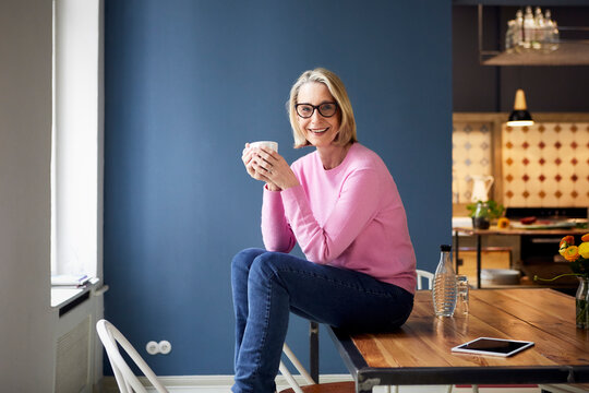 Portait of confident mature woman at home