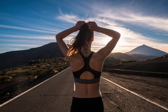 Young woman training on empty street