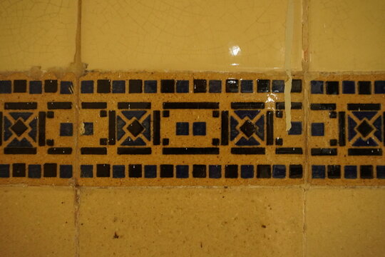 Geometric pattern on vintage ceramic tile textured background