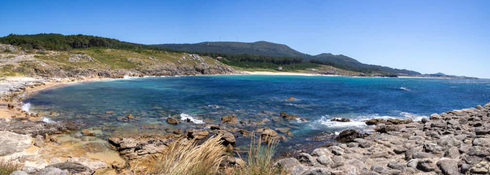Prehistoric Celtic ruins of Castro de Baro&ntilde;a in Porto do Son, Galicia, Spain. Ancient Iron Age circular stone houses and fort fortress on a rocky coast peninsula facing the blue Atlantic Ocean.