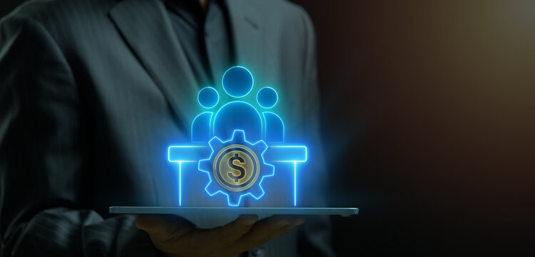 Hand showing glowing teamwork people with gear and dollar coin icon. HR payroll management and corporate personnel concept.
