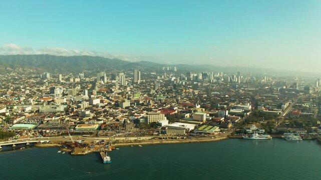 Cebu city overview: seaport with ships and ferries. Capital city of the province of Cebu and is the second city of the Philippines after Metro Manila during sunrise.