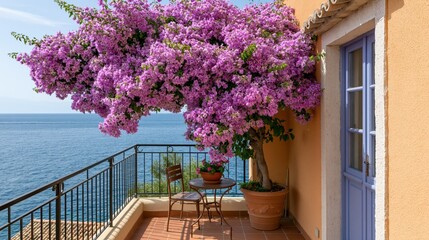 Fototapeta premium Idyllic Mediterranean balcony with blooming bougainvillea overlooking the sea