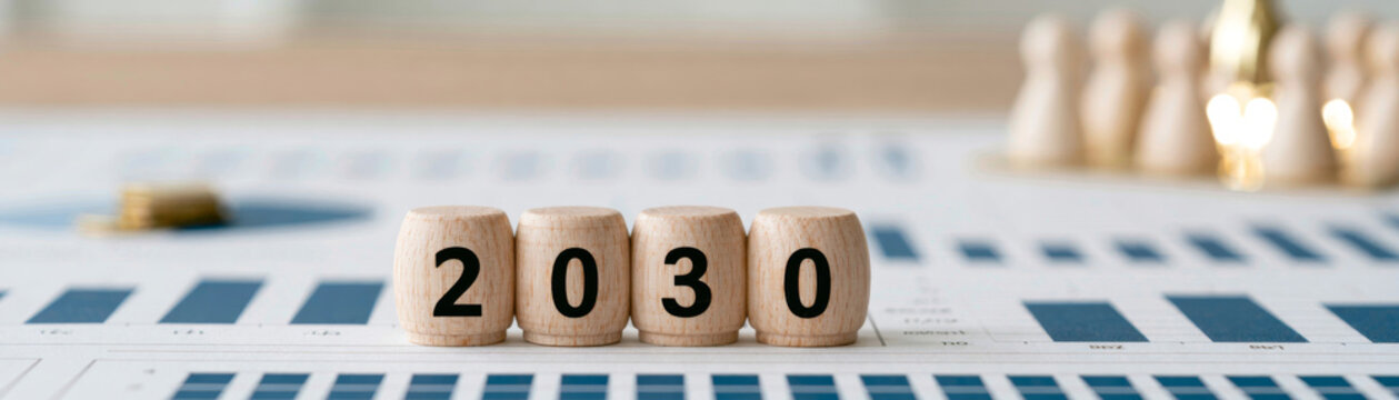 Business roadmap futuristic business vision for 2030 with wooden blocks on financial chart, symbolizing planning, growth, and future strategy in corporate environment