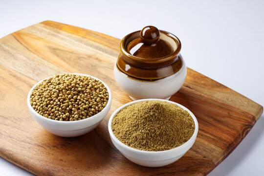 Indian spice called Coriander seeds or Dhania Khada and Dhaniya Powder selective focus 