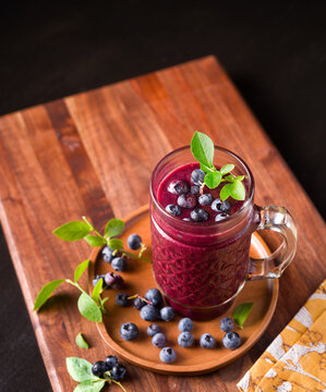 Fresh and healthy blueberry smoothie made from fresh homegrown blueberries;  copy space
