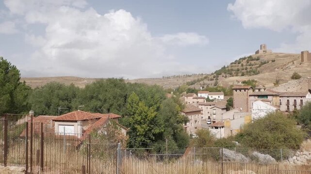 Panoramic view of Molina de Aragon with historic castle on hill and village below