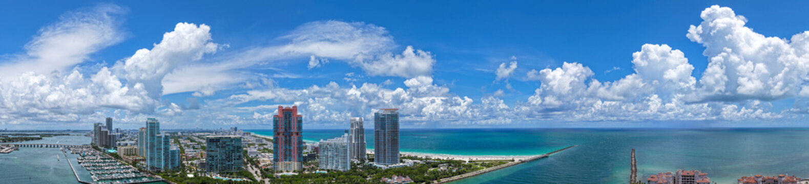Summer travel sea vacation. City panorama. Aerial panoramic marina. Miami South beach. Aerial skyscraper cityscape with marina panorama. Travel destination. Luxury skyscraper in Miami, Florida