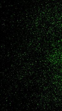 Microscopic view of glowing green particles suspended in dark liquid, abstract science background