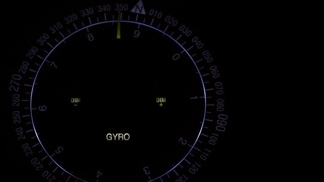 Night view of Gyro compass fitted onboard the bridge of a merchant ship underway at sea.