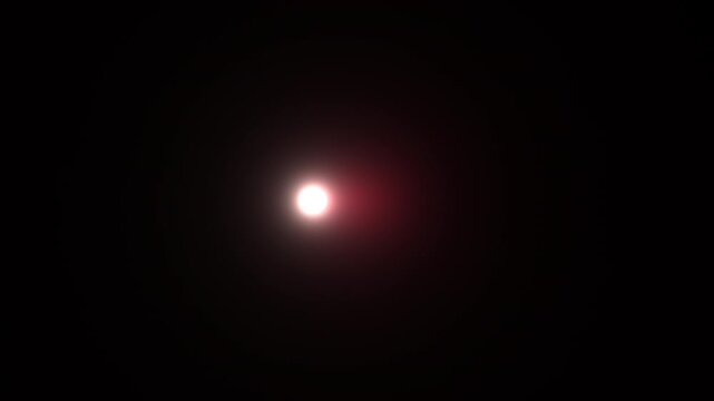 Bright light glowing in dark space with slight motion effect