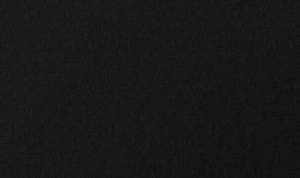 a dark black textured paper background. The matte surface features subtle horizontal and vertical fiber patterns, simulating premium cardstock or canvas
