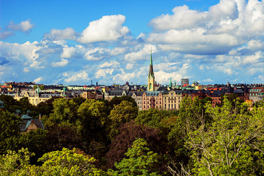 View across Stockholm from Djurg&aring;rden with the green spire of Oscarskyrkan in &Ouml;stermalm, Sweden