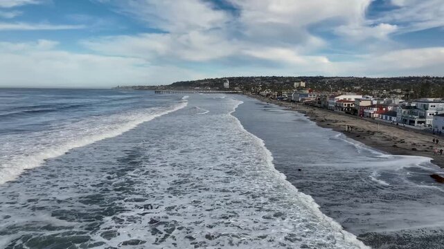 Powerful King Tides Washing Over Pacific Beach During A Calm Morning In San Diego, California. Drone Flyover.