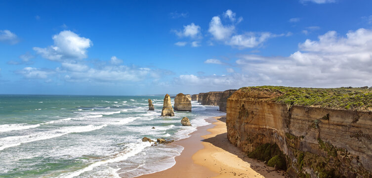 Panorama of the Twelve Apostles and coastline of the Great Ocean Road, Australia. These limestone sea stacks are located along the shore line of Port Campbell National Park.
