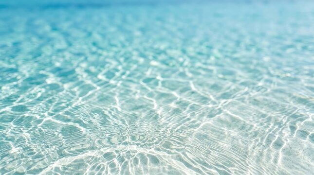 Turquoise ocean water surface with sunlight and ripples close up view
