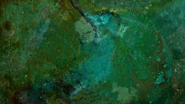 Macro timelapse of copper patina formation with evolving oxidation patterns. Colorful abstract metallic texture featuring corrosion, mineral deposits and natural chemical processes