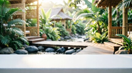 Fototapeta premium Tropical Bamboo Garden with Wooden Bridge and White Tabletop for Product Display