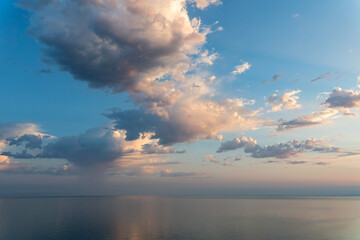 Fototapeta premium Colorful sunrise over the sea with orange clouds.