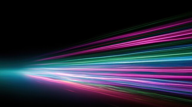 Abstract colorful light trails speeding forward on black background