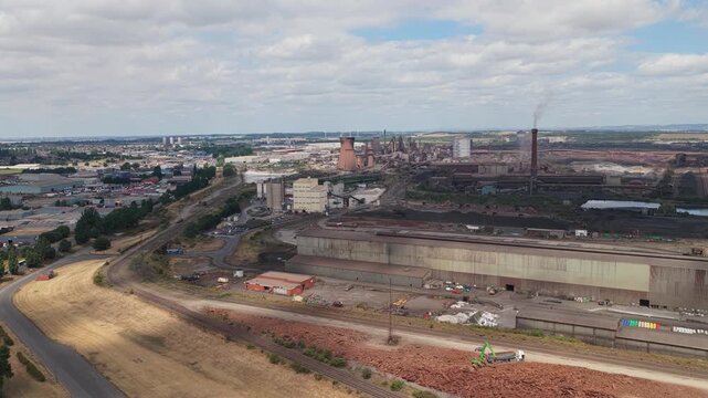 Overhead View of an Active Steel Mill Industrial Site During the Day