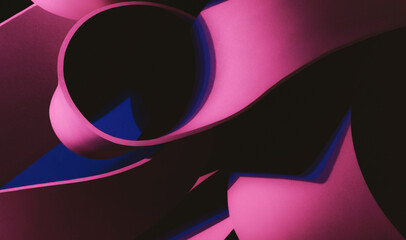 Geometric shapes illuminated by pink light, abstract dark background