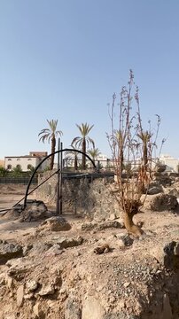 Stone ruins and modern pipes at othman well, in madina saudi arabia.