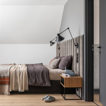 Cozy Bedroom Interior with Contemporary Design and Natural Light, Featuring a Comfortable Bed and Stylish Decor