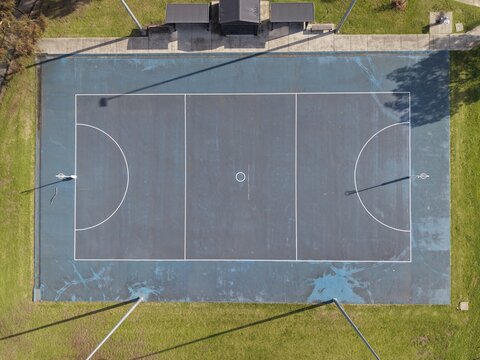 Aerial view netball court lines on blue surface