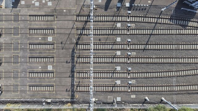 Aerial view of multiple railway tracks and geometric patterns
