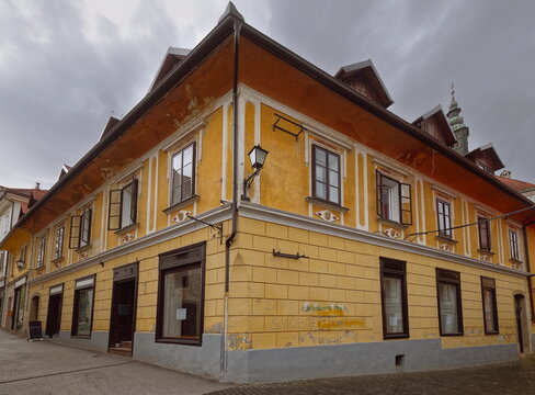 Corner house ornate with human heads protruding from rhomboid medallions under the windows, Mestni trg and Blazeva ulica sts. Skofja Loka-Slovenia-142