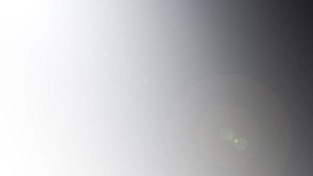 Abstract dynamic gradient background with charcoal grey and light silver transitions and light flare