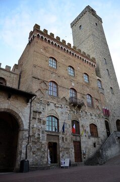 San Gimignano, Italy 03.04.2020: Town Hall (also known as the Palazzo del Popolo or Palazzo Nuovo del Podest&agrave;) and the Torre Grossa in San Gimignano