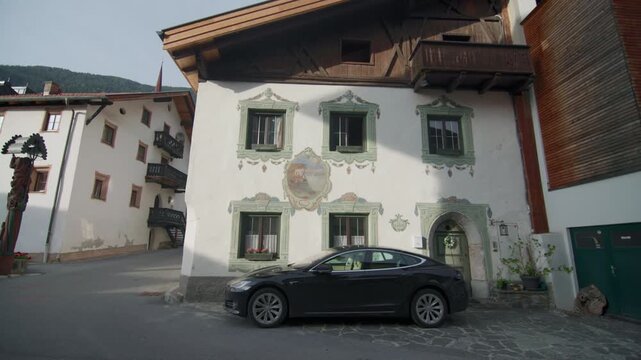 Architecture and landscape of the Tyrolean villages in the Oetz Valley Austria. Umhausen cityscape with historic houses tourist streets, travel in alpine mountain Europe.