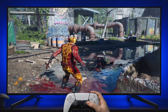 Marvel's Wolverine Bloody Combat Gameplay Displayed on TV Screen with PS5 Controller Held in Hand