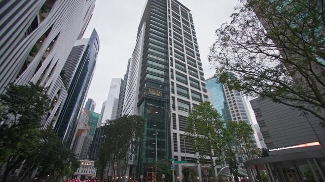 Singapore City downtown skyline with impressive office towers financial centers modern urban architecture and busy tourist streets for travel and tourism in Asia